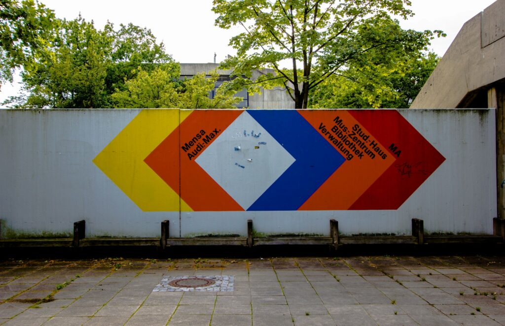 A large colorful sign on the side of a building